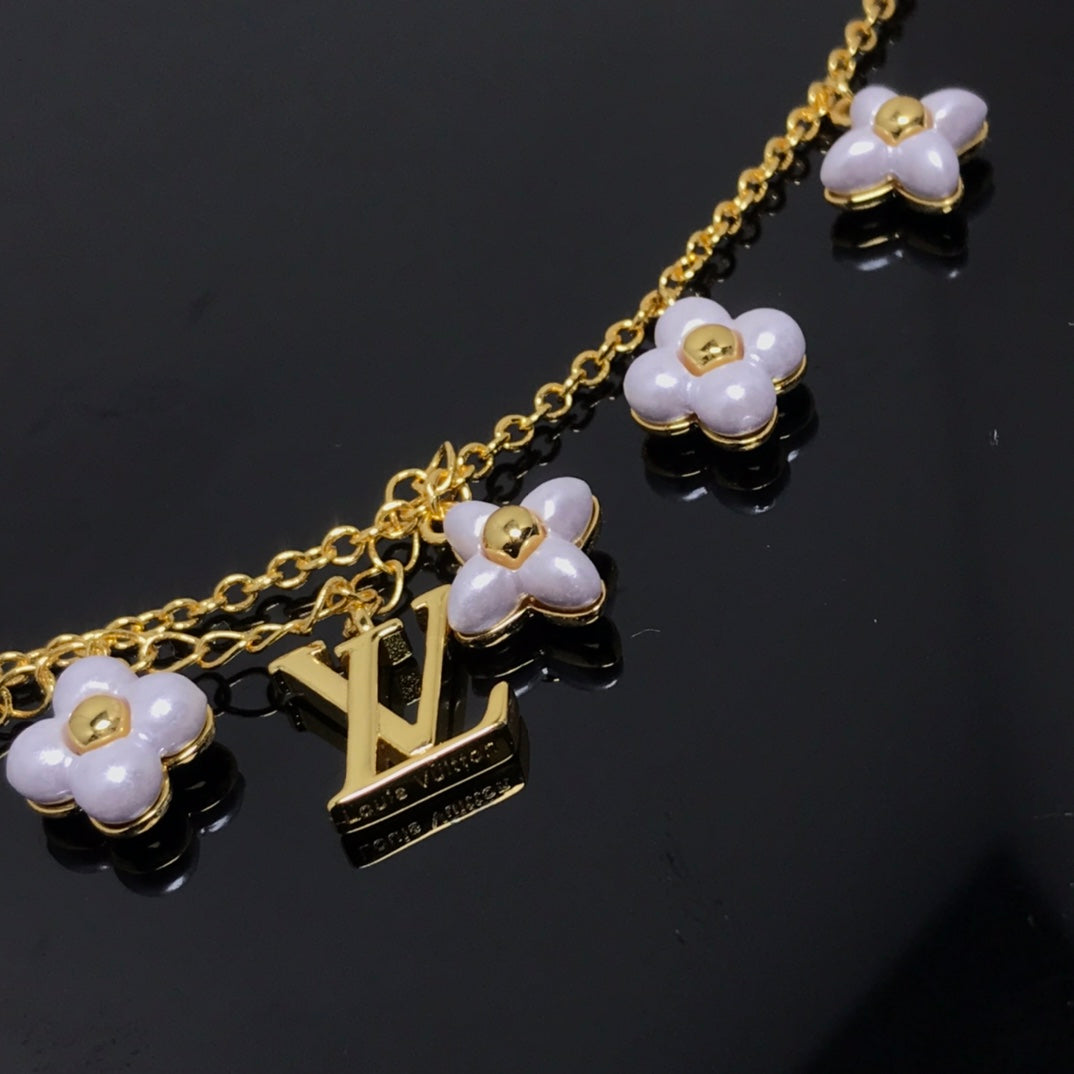 Miro LOGO 6 MOTIF STAR AND SUN GOLD BRACELET